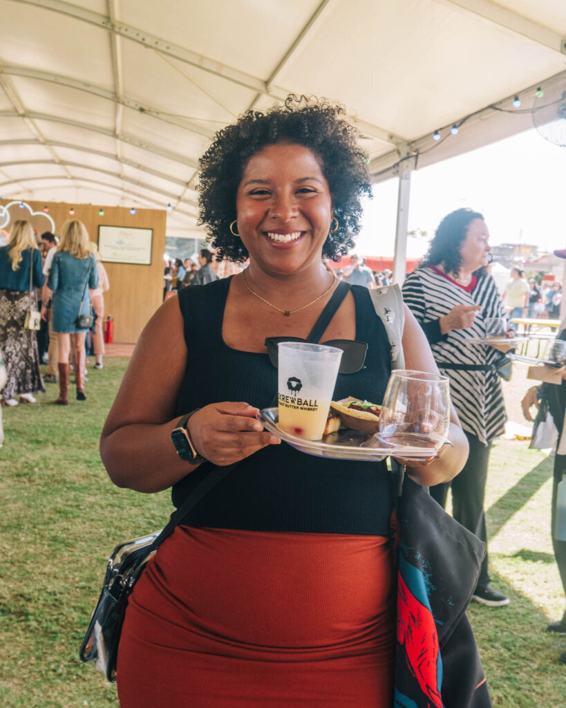 Food photographer enjoying bites and drinks at Austin Food & Wine Festival